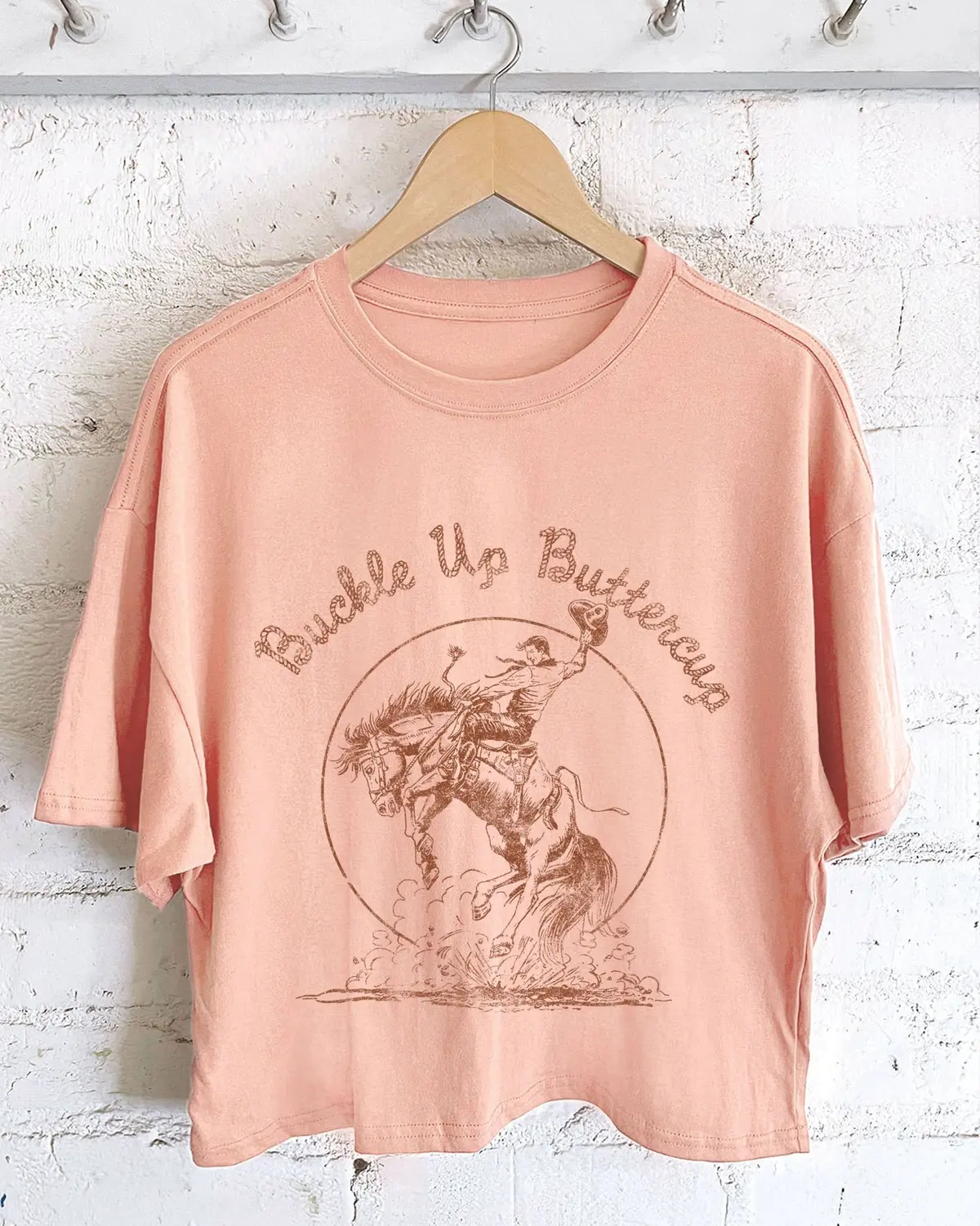 Buckle Up Buttercup Cowboy Long-Crop Tee (Peach) 1