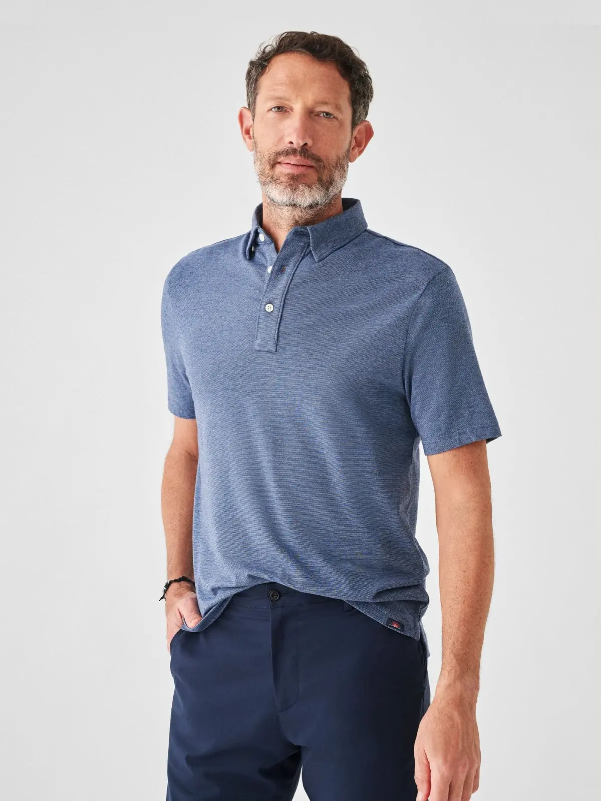 Faherty Short Sleeve Movement Polo In Sea Navy Melange 1